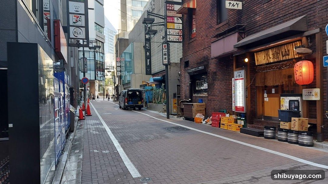 Urban Street Scene with Storefronts and Vehicles