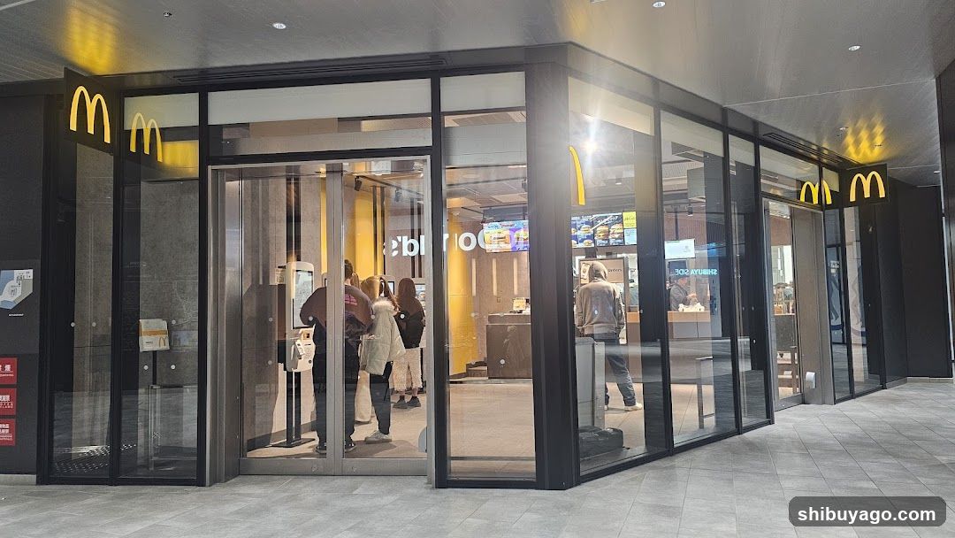 Photo of physical exterior entrance/storefront facade with visible McDonald's signage on building.