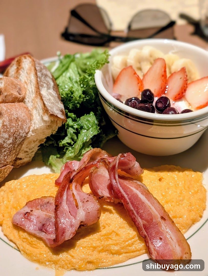 Breakfast Plate with Bacon, Omelette, Salad and Fruit Bowl