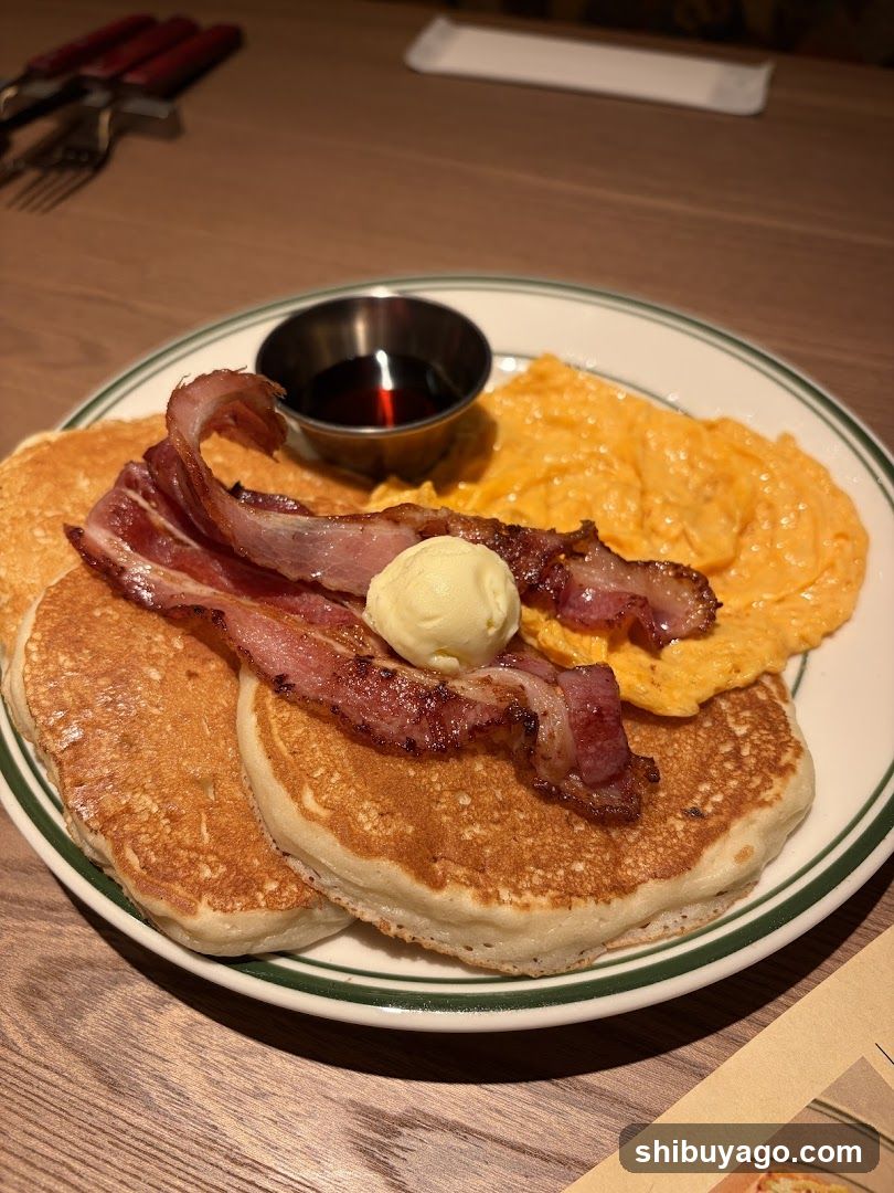 Breakfast Plate with Pancakes, Bacon, and Omelette