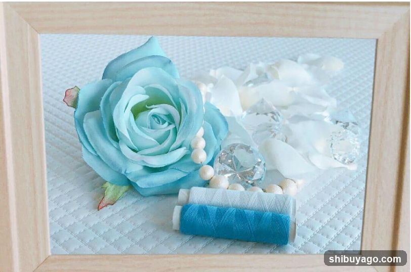 Blue Rose and Thread Arrangement