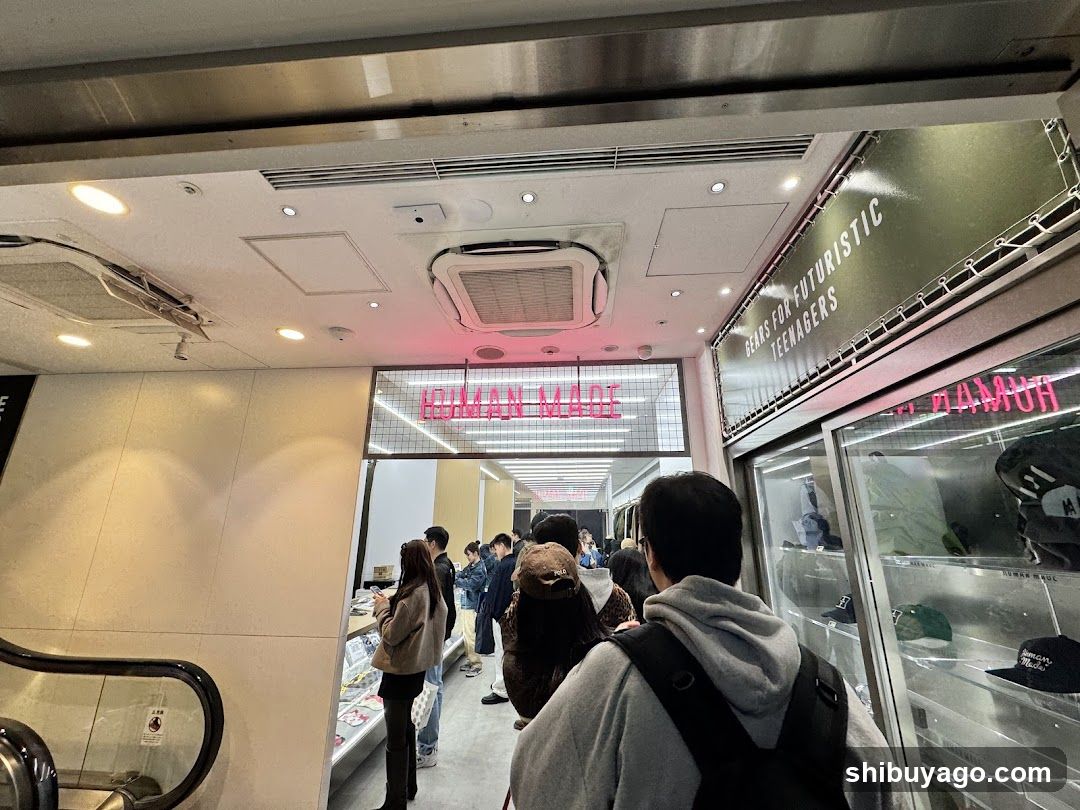 Crowded Store Entrance with Neon Signage
