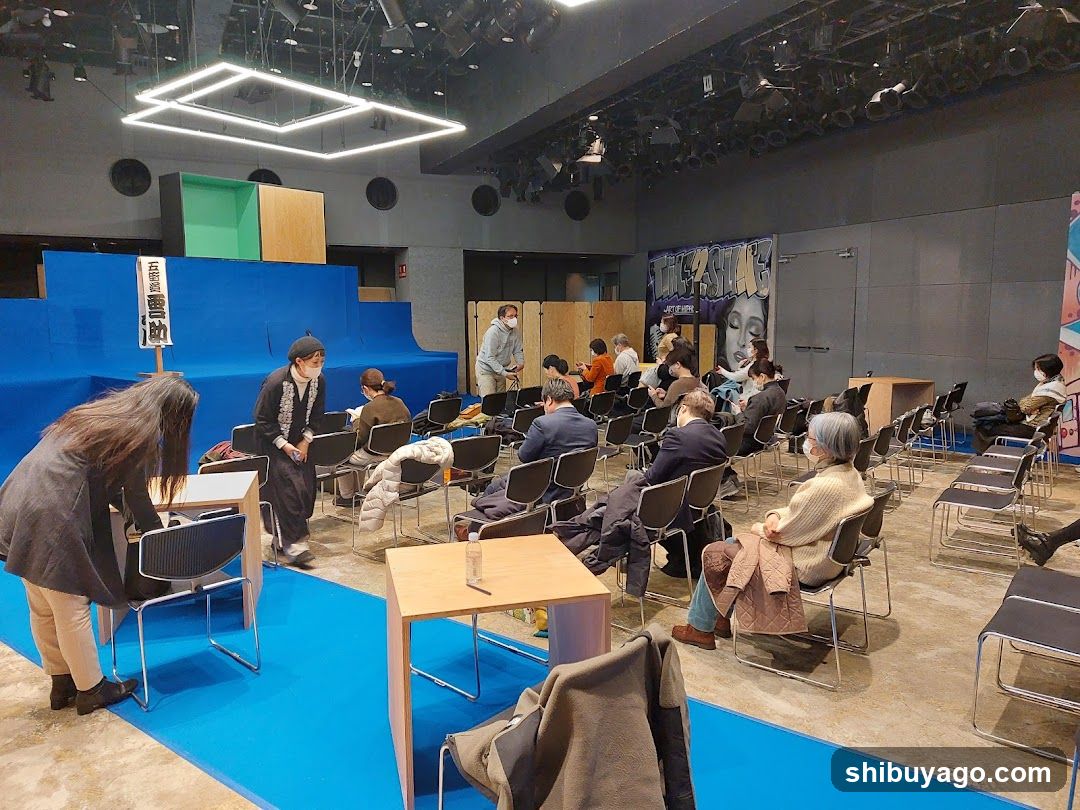 Theater Interior with Audience and Performers