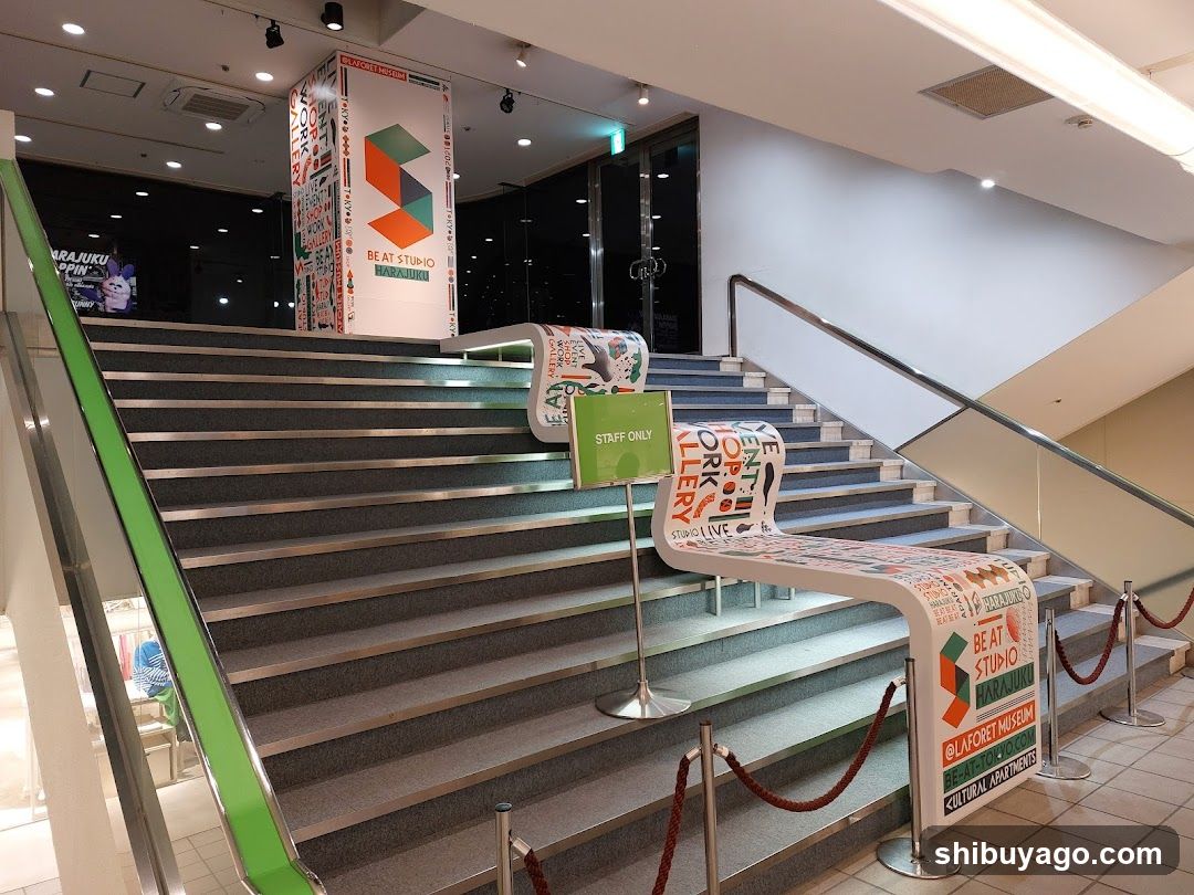 Staircase with promotional banners and signage