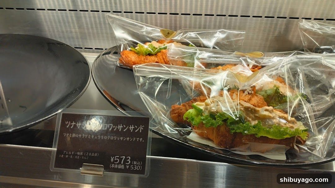 Café Display Case with Croissant Sandwiches