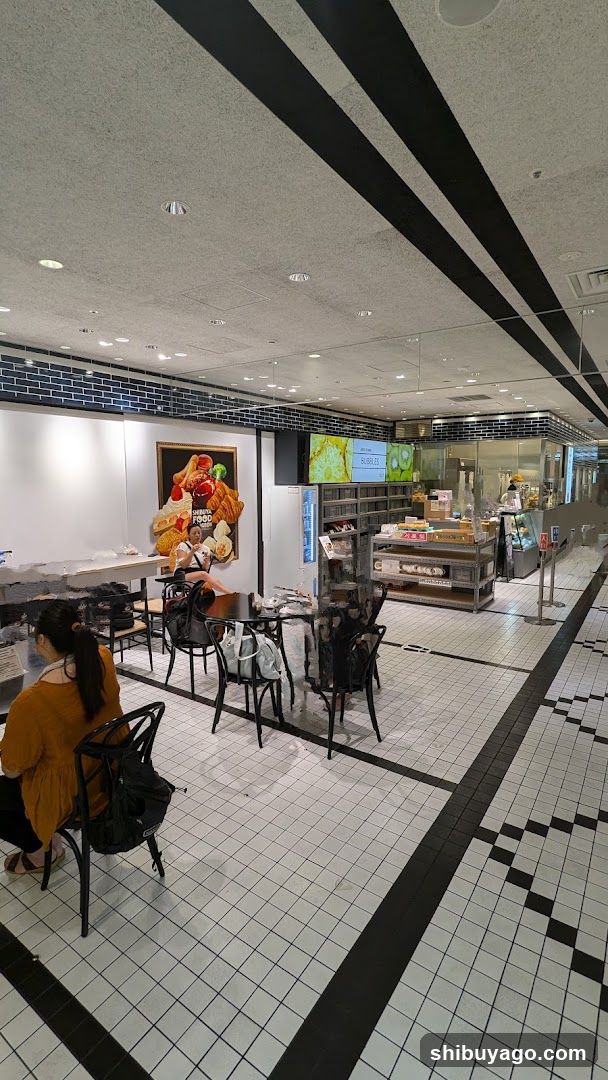 Interior of a food establishment with tiled floor and seating area