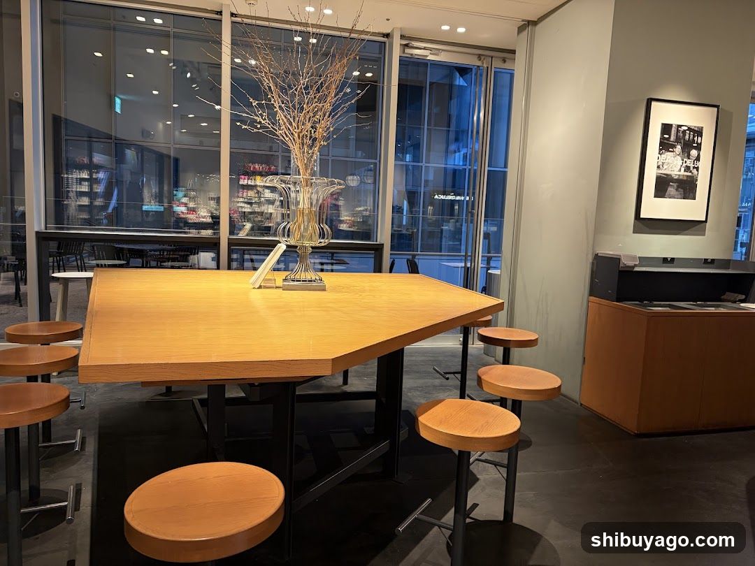 Interior seating area with large table and stools