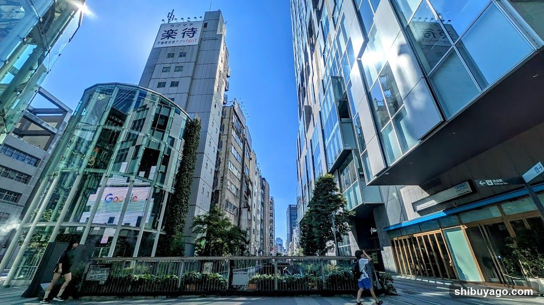 Urban street scene with modern buildings and pedestrians