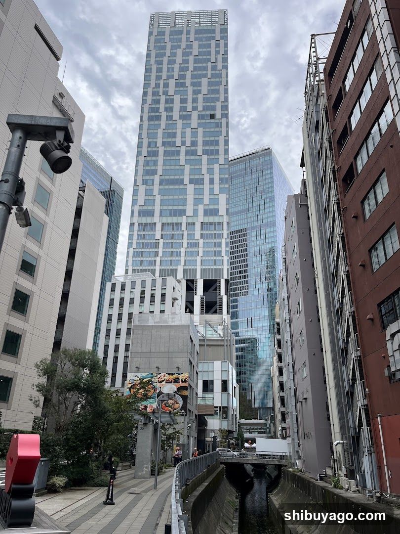 Urban Street View with Modern Skyscraper and Canal