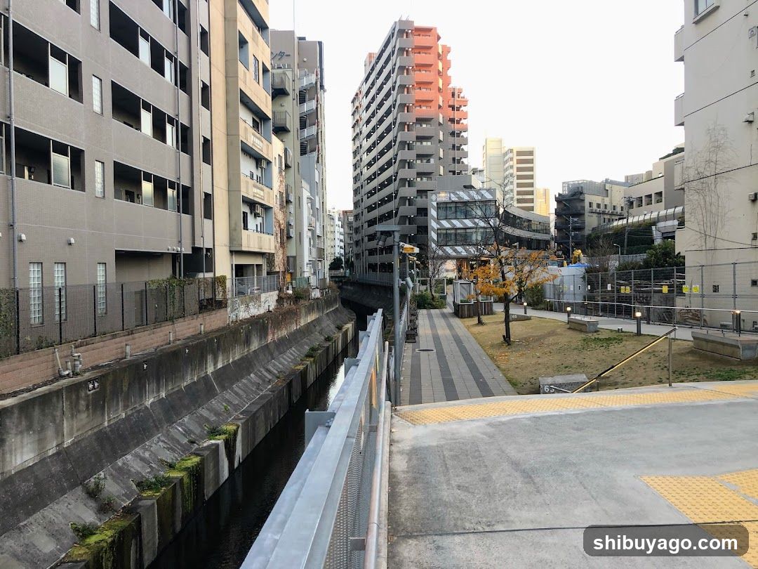 Urban Canal Walkway with Residential Buildings