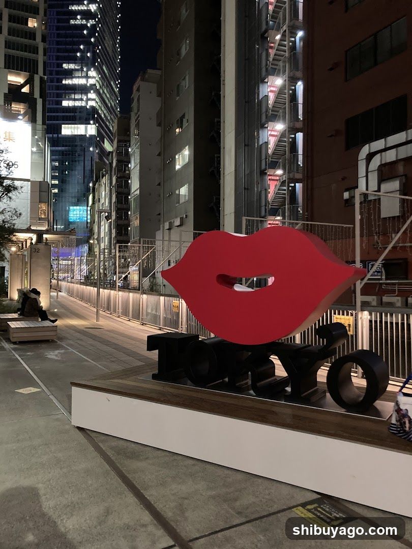 Night City Street with Red Lip Sculpture