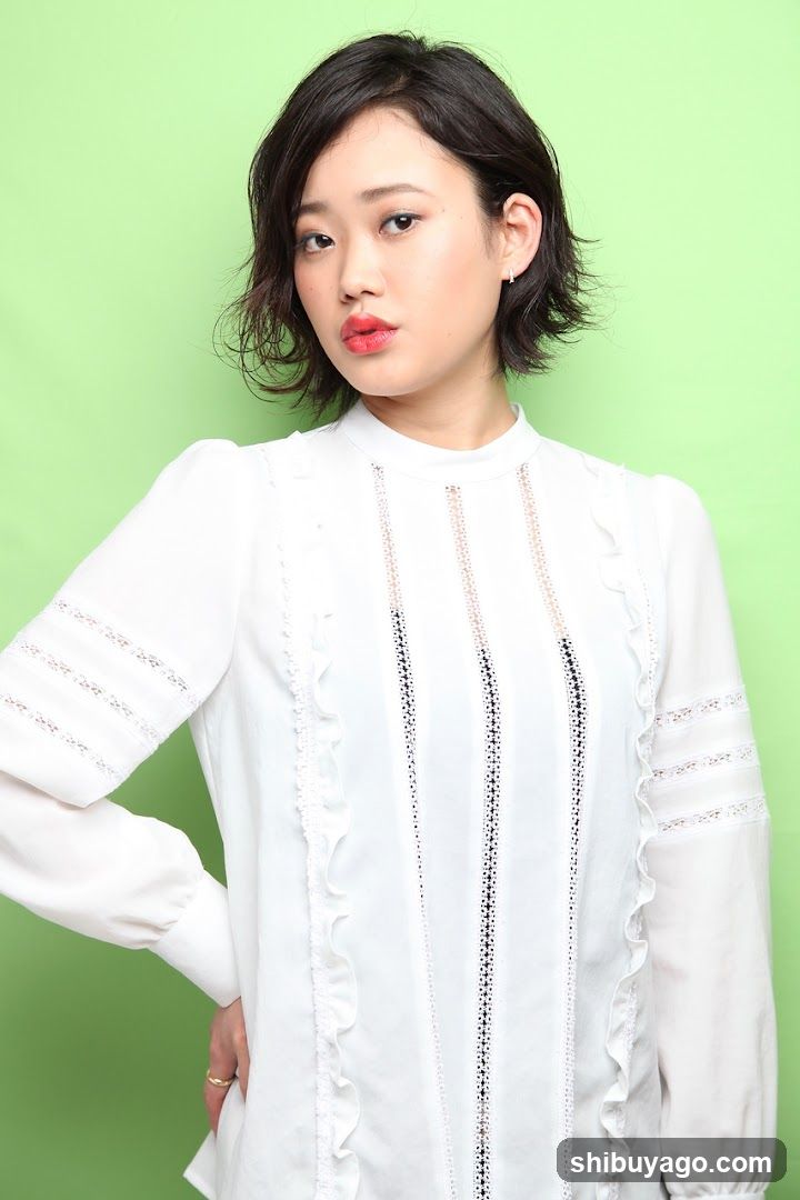 Portrait of a woman in white blouse