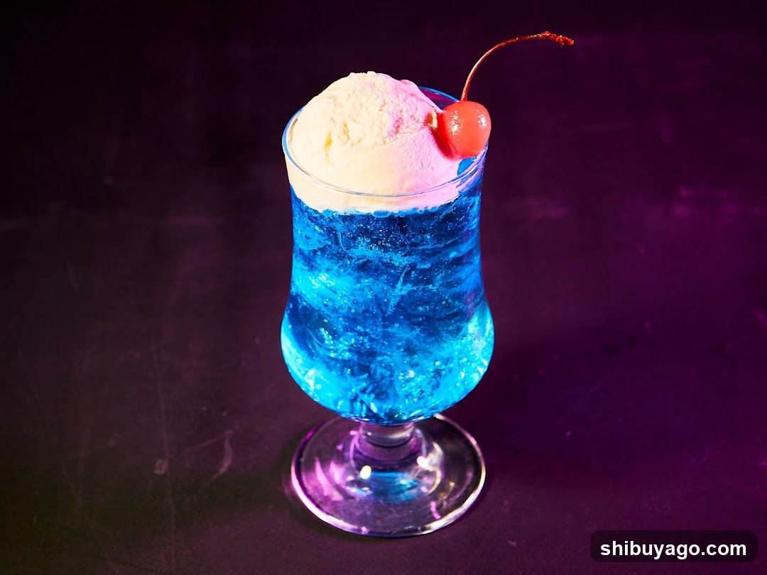 Blue Cocktail with Ice Cream and Cherry