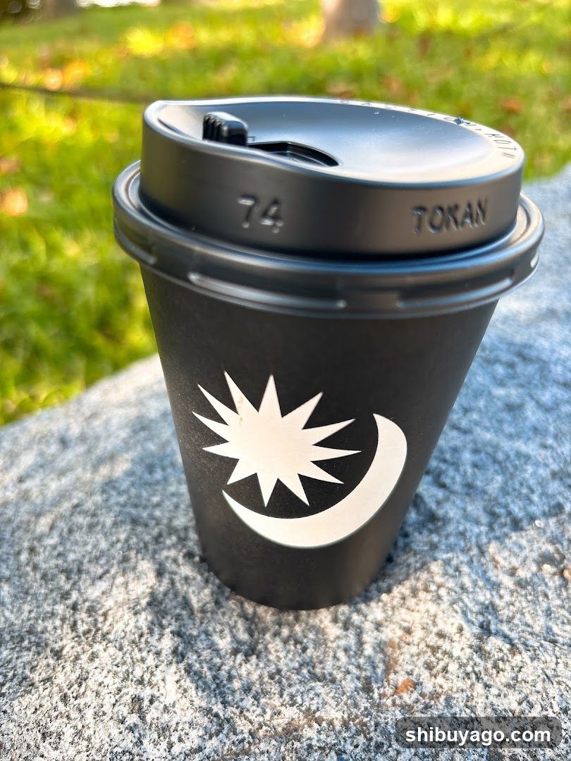 Black coffee cup with crescent and star logo
