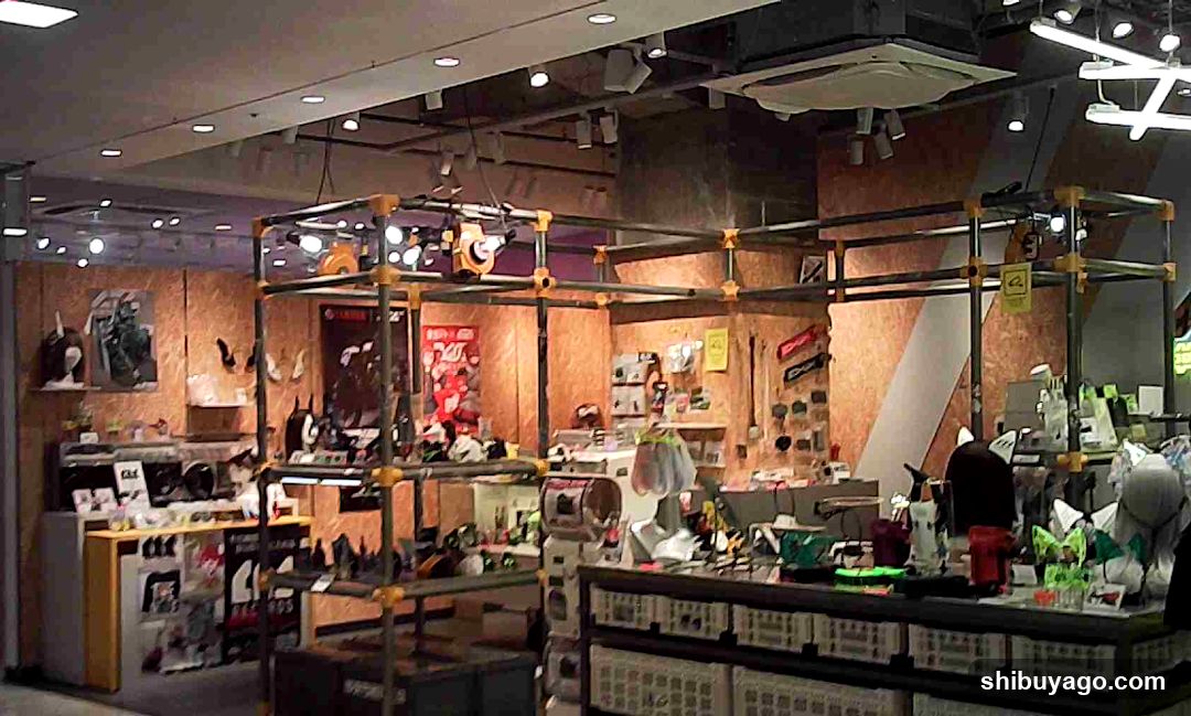 Interior of a retail store with industrial shelving and merchandise displays
