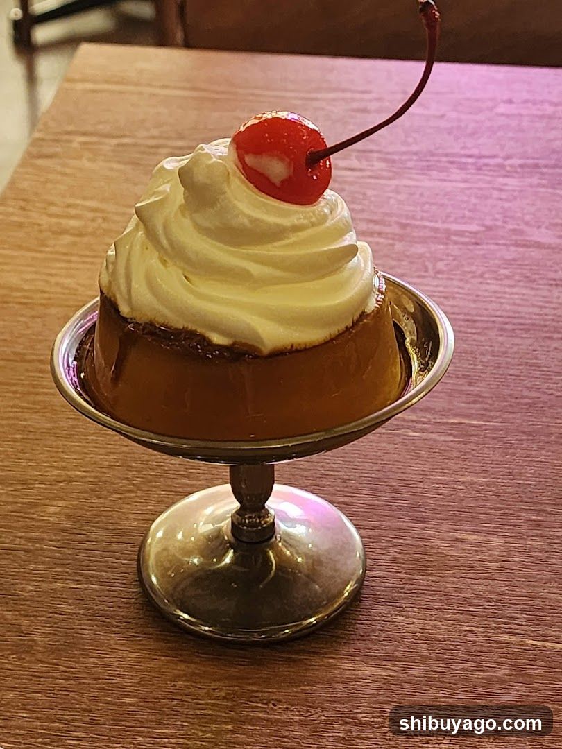 Caramel Pudding with Whipped Cream and Cherry