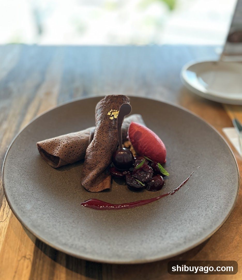 Chocolate Crepe Dessert with Cherries and Gold Leaf