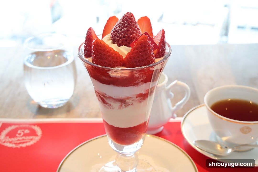 Strawberry Dessert with Tea and Water