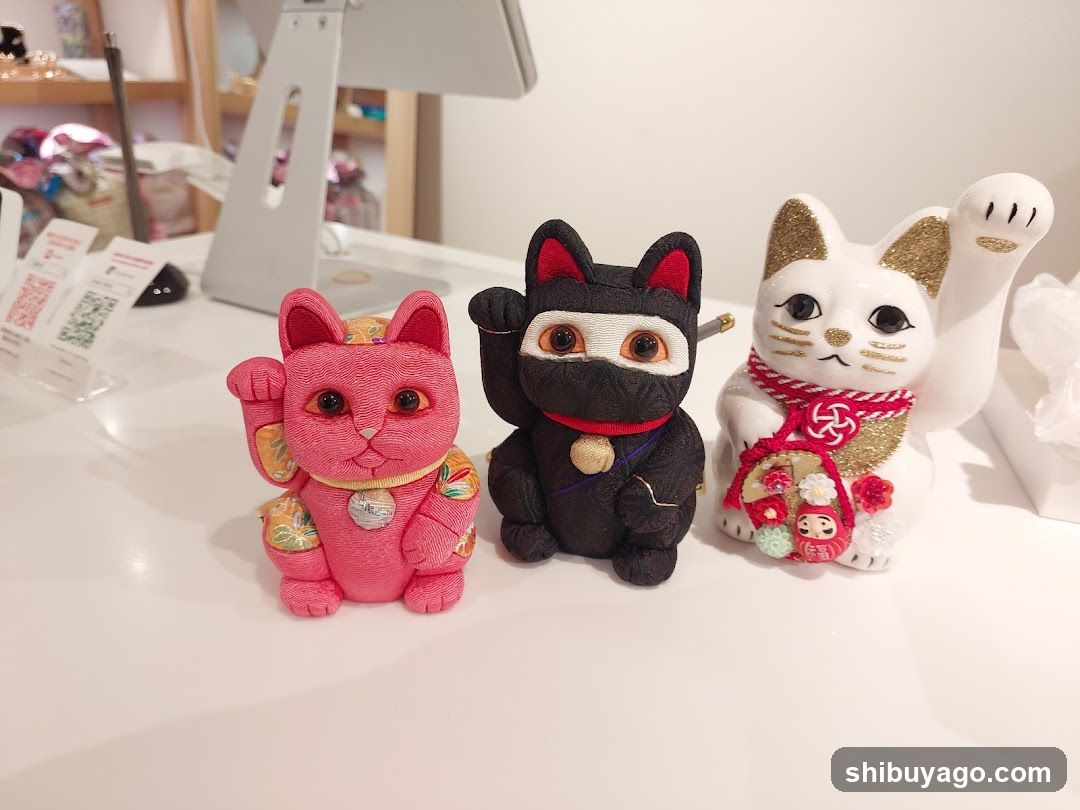 Three Lucky Cats on a Table