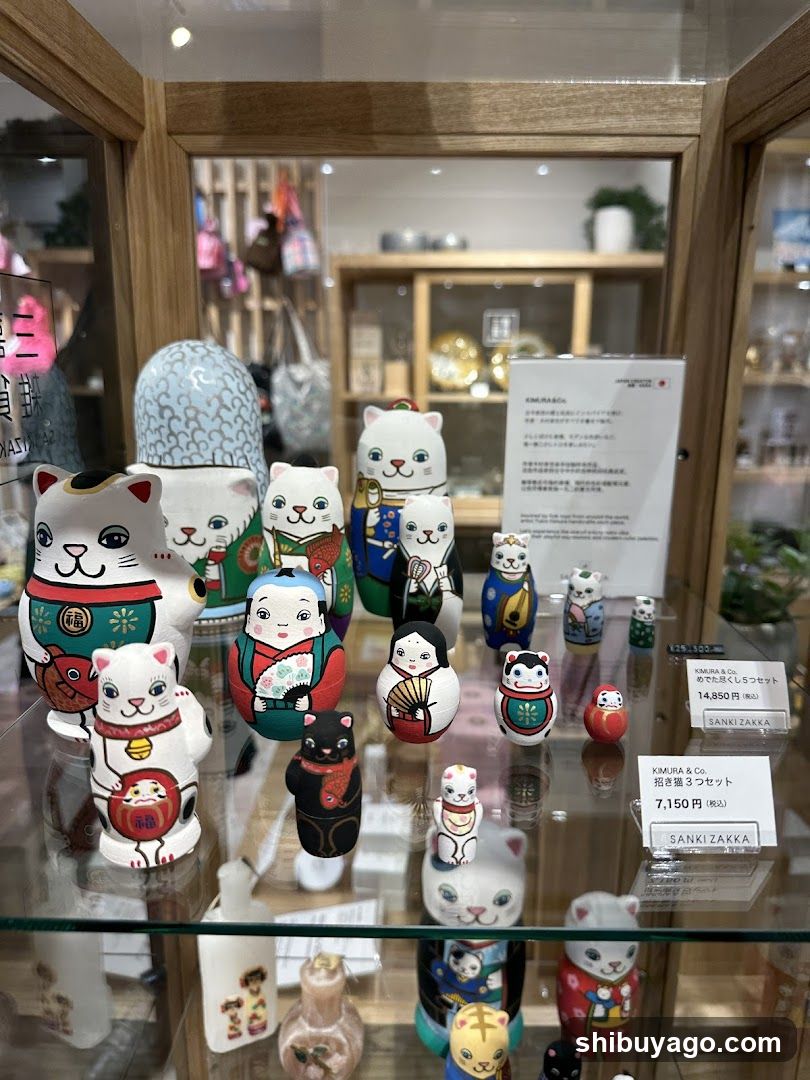 Display of Japanese Maneki-neko figurines in a shop