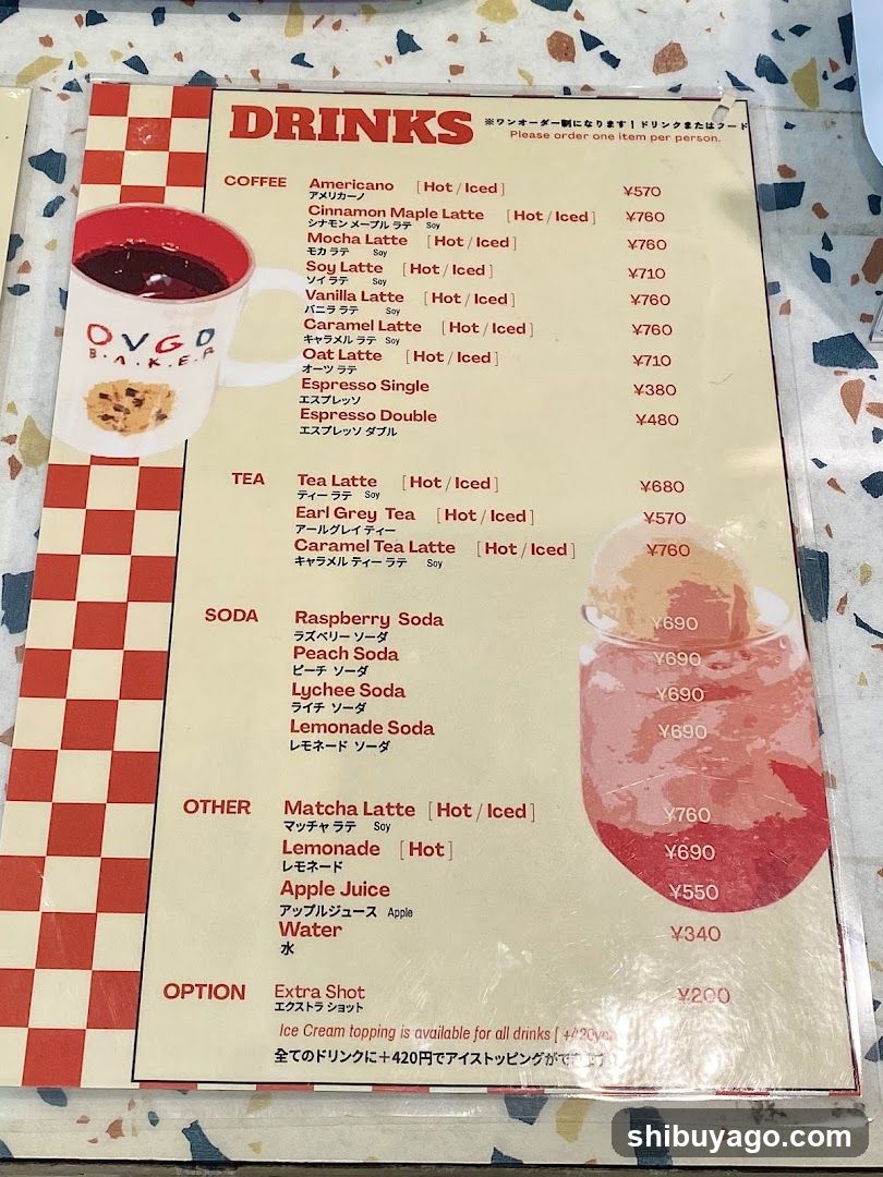 A printed menu listing various drinks including coffee, tea, soda, and other options with prices in yen.