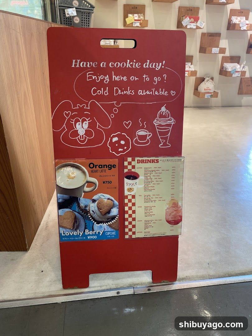 Red A-frame sign with menu and cartoon graphics