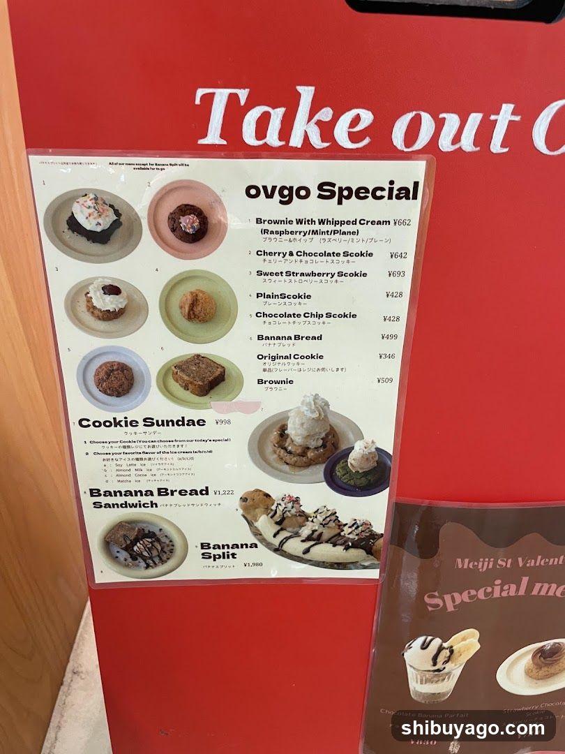 A printed menu board attached to a red stand, featuring various desserts and their prices.