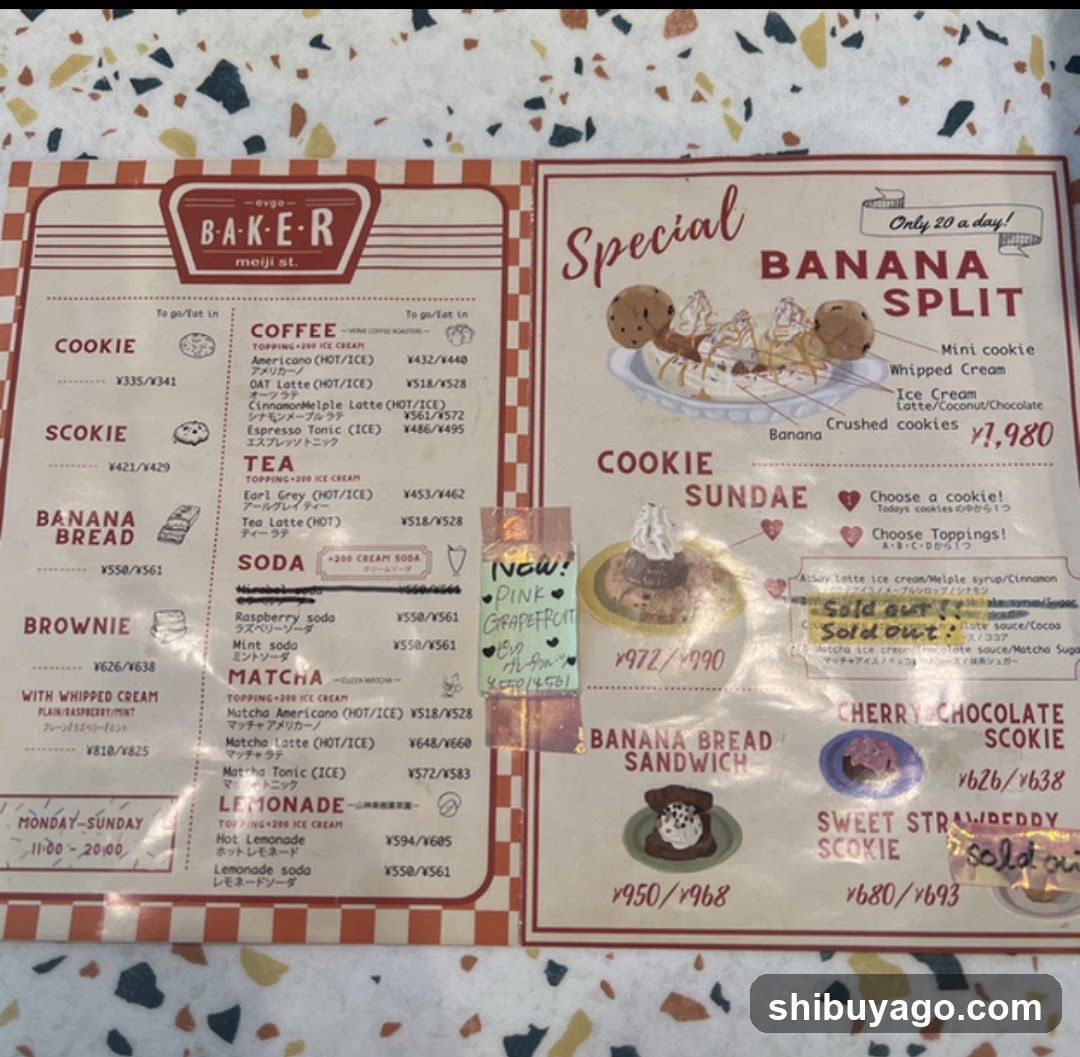A two-page menu from a bakery named 'Baker' located at moji st. The left page lists items like Cookie, Scookie, Banana Bread, Brownie, Coffee, Tea, Soda, Matcha, and Lemonade with prices in yen. The right page features special offers including Banana Split, Sundae, Cherry/Chocolate Cookie, Sweet Strawberry Cookie, and Banana Bread Sandwich, also with prices.