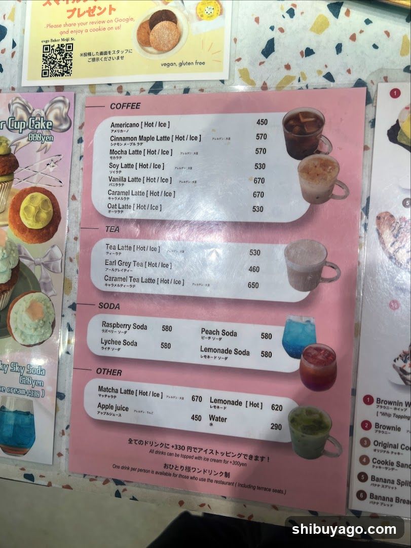 A menu board displaying coffee, tea, soda, and other drinks with prices in yen.