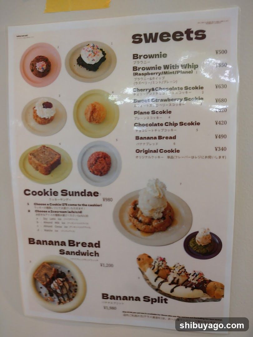 A printed menu featuring various sweets and desserts, including Brownie, Brownie With Whip, Cherry & Chocolate Scookie, Sweet Strawberry Scookie, Plane Scookie, Chocolate Chip Scookie, Banana Bread, Original Cookie, Cookie Sundae, Banana Bread Sandwich, and Banana Split.