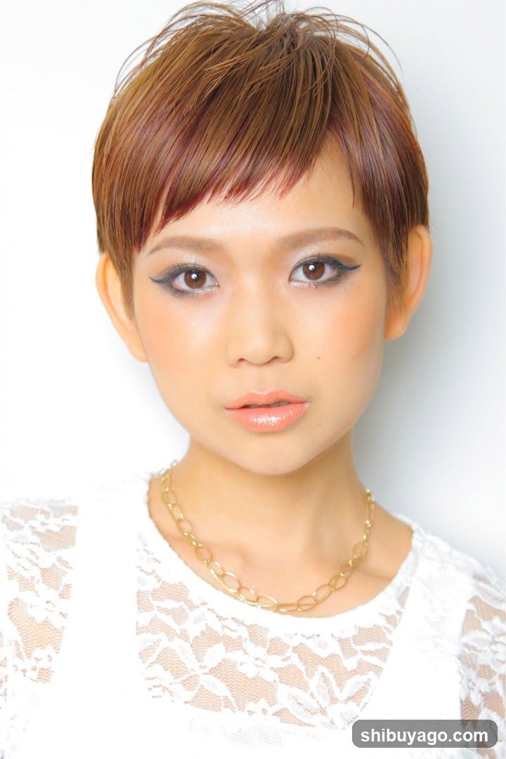 Portrait of a woman with short brown hair and makeup