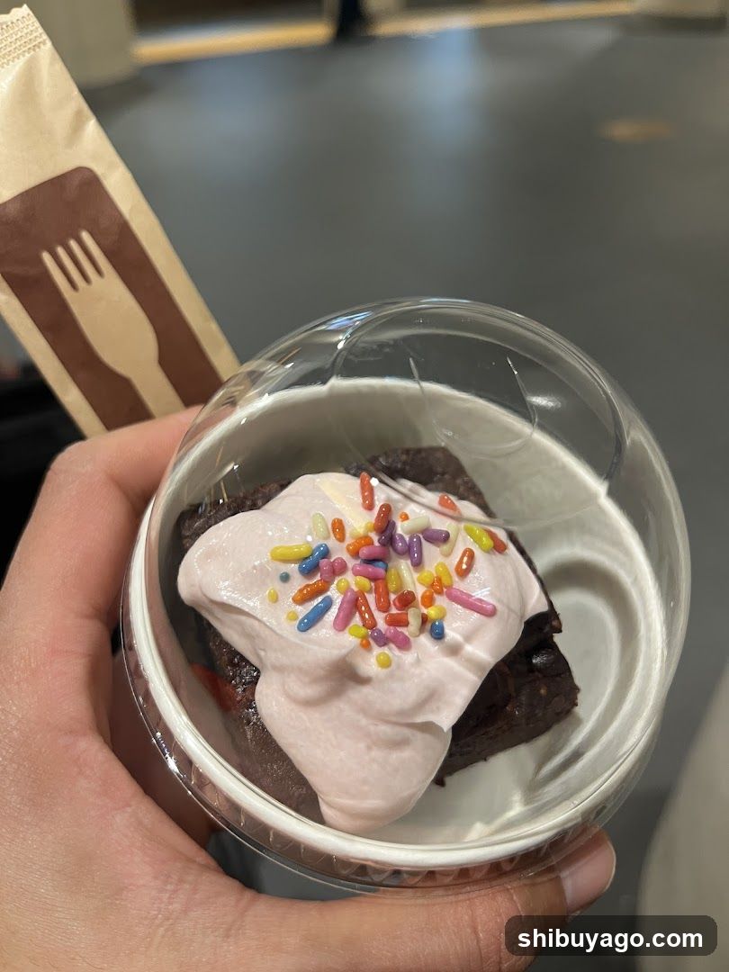 Brownie with whipped cream and sprinkles