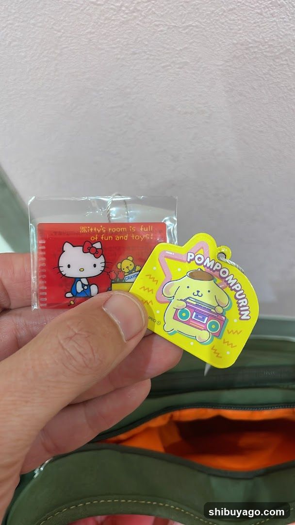 Hello Kitty and Pompompurin Keychains