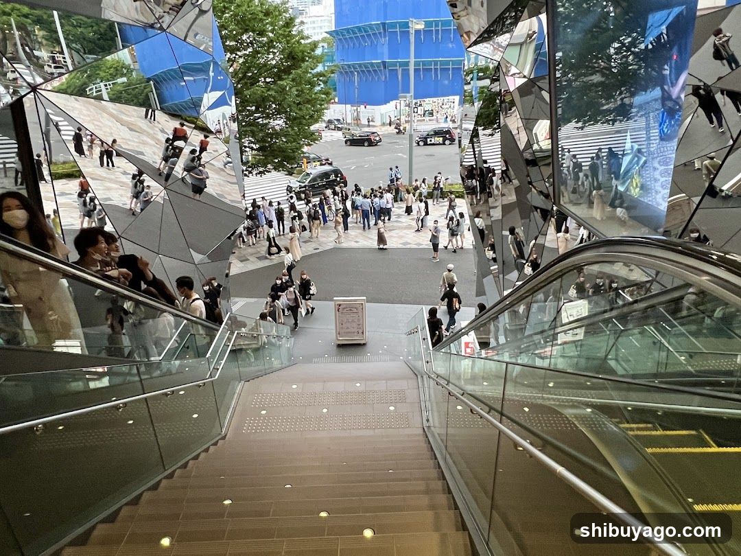 Modern urban plaza with reflective architecture and escalators