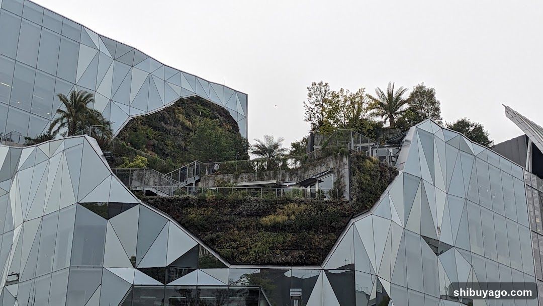 Geometric Glass Building with Green Roof