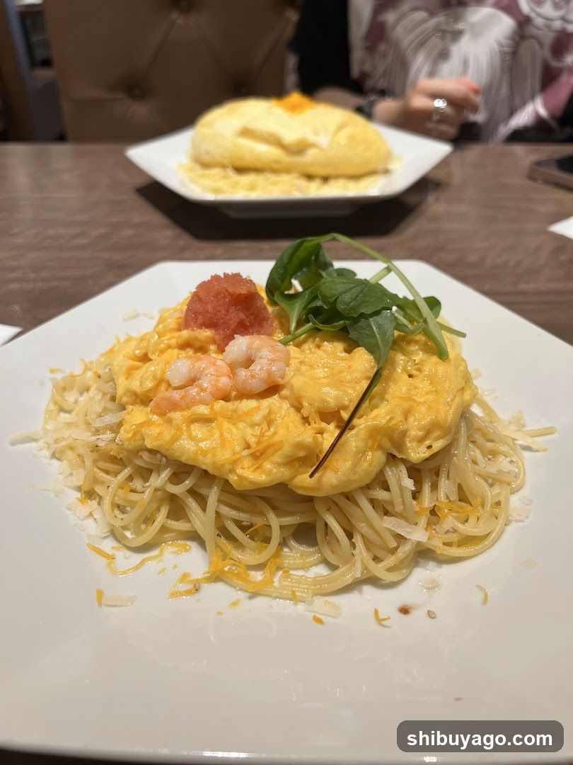Shrimp Scrambled Eggs Pasta with Omelette in Background
