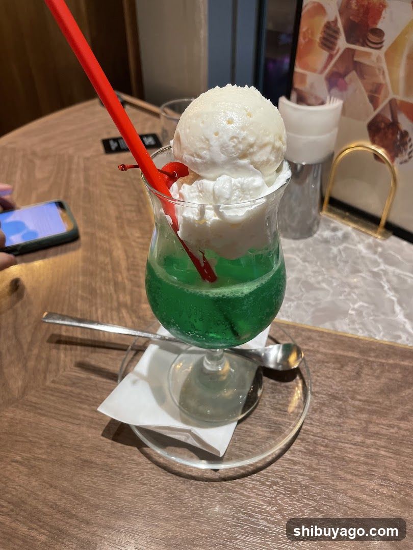 Green Ice Cream Drink with Red Straw