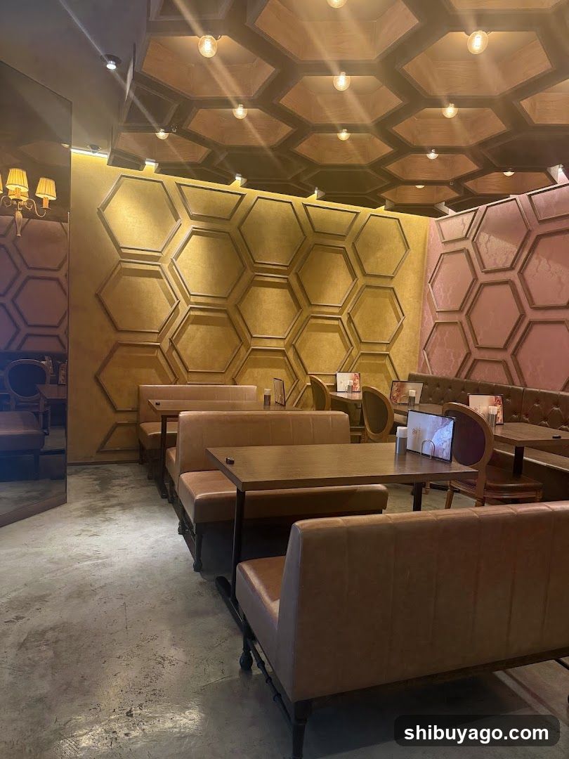 Interior of a restaurant with hexagonal wall design