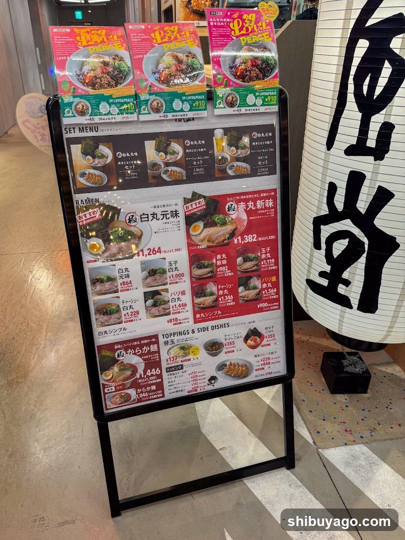 A menu board displaying various ramen options with prices and images of the dishes.