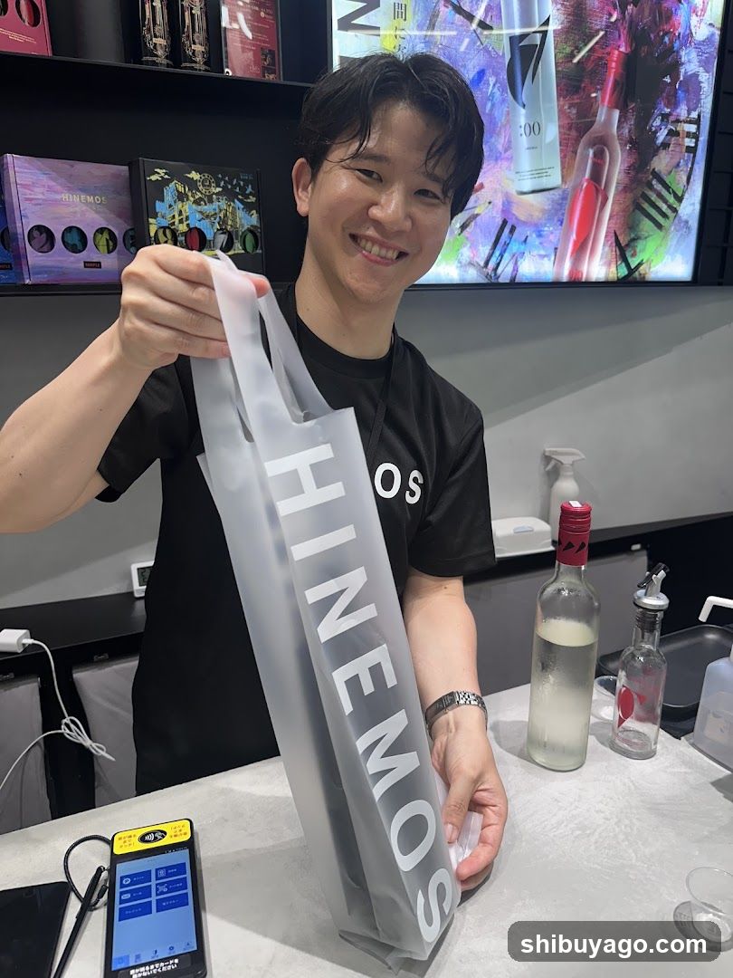 Staff holding HINEMOS bag