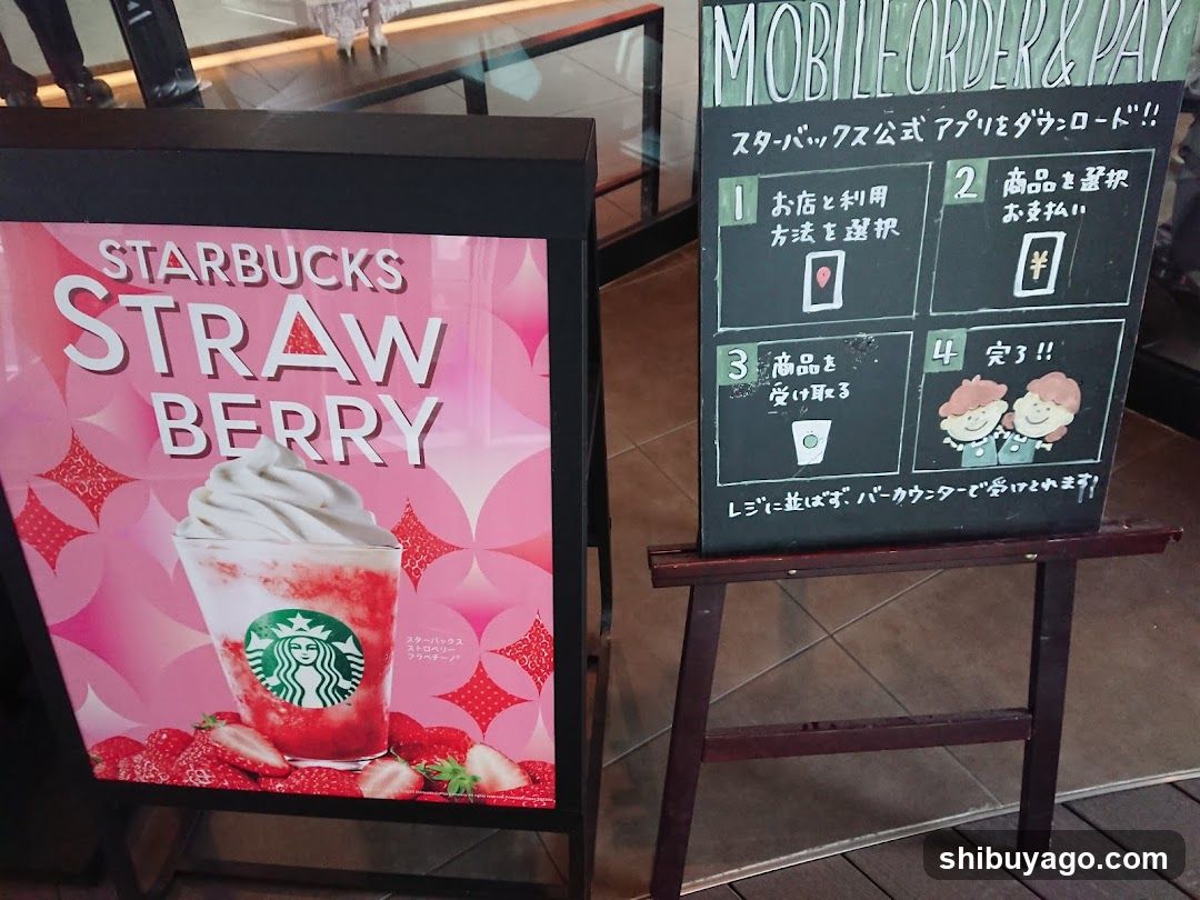 Starbucks Strawberry Drink Ad and Mobile Order Sign