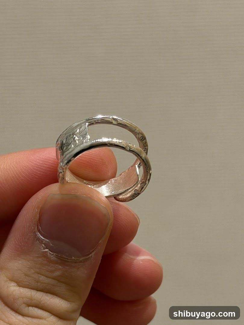 Silver Ring Held in Hand