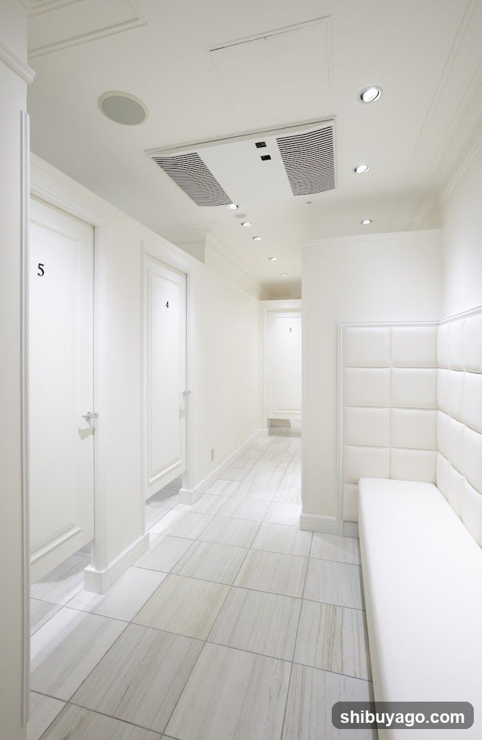 White Interior Hallway with Numbered Doors