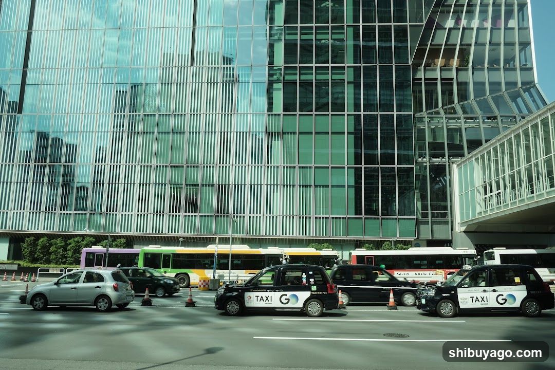 Urban Street Scene with Taxis and Buses