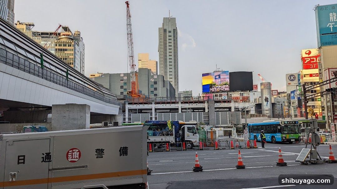 Urban Construction Scene with Vehicles and Billboards