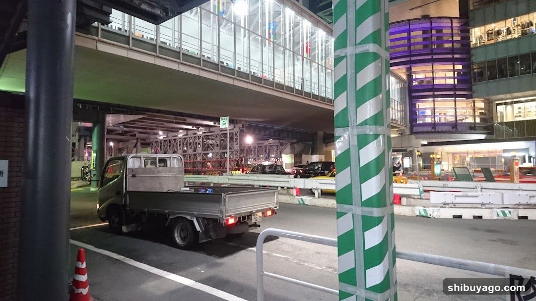 Nighttime Urban Street Scene with Truck