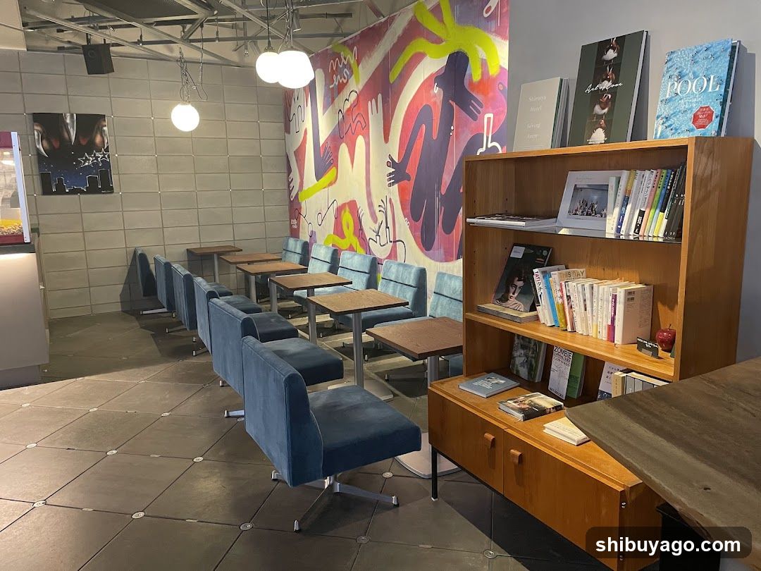 Interior seating area with bookshelf and artwork