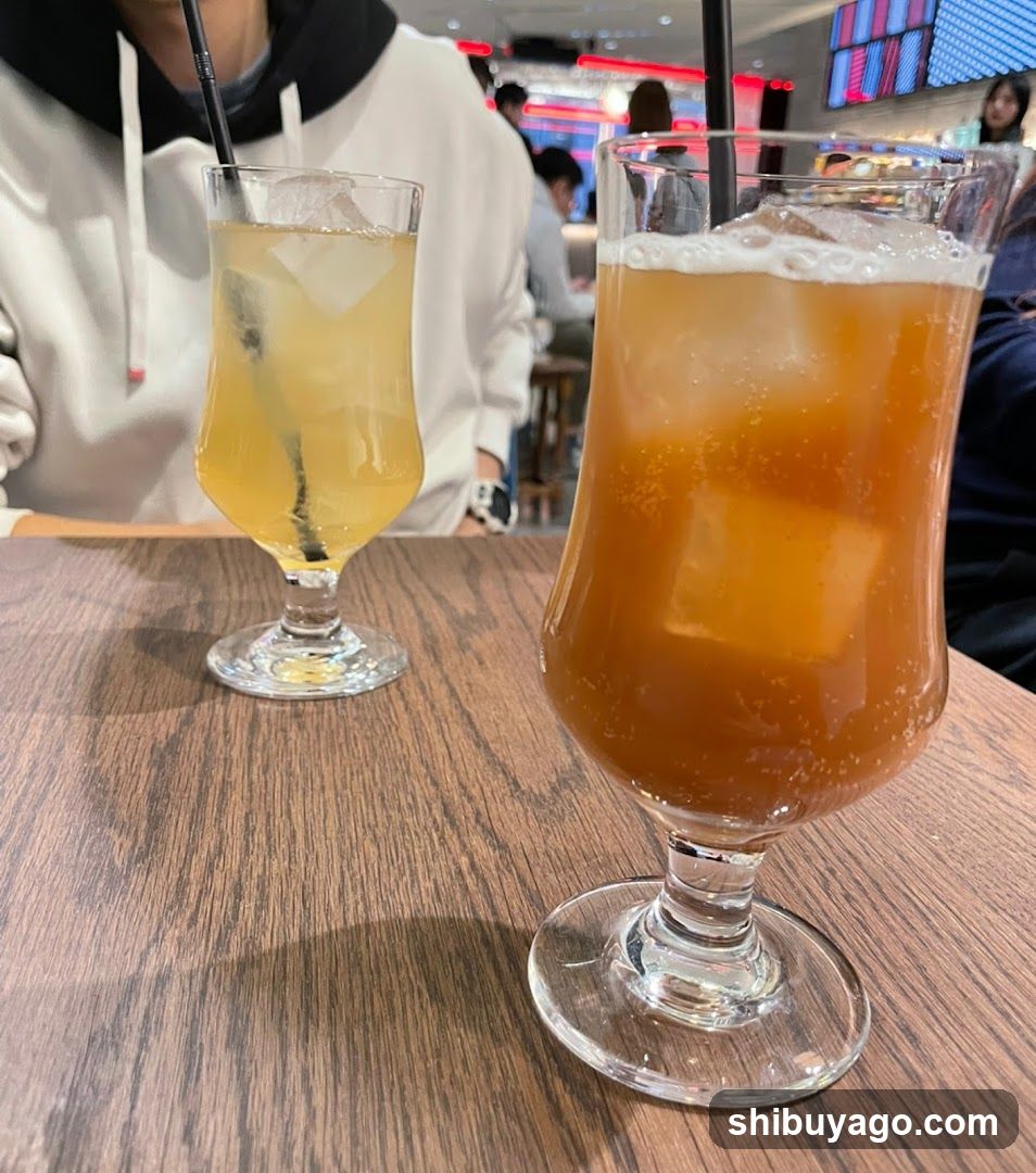 Two Iced Drinks on a Wooden Table