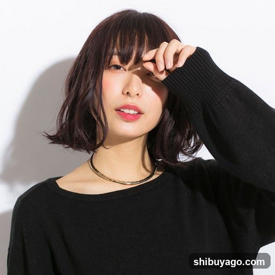 Portrait of a woman with short hair and black sweater