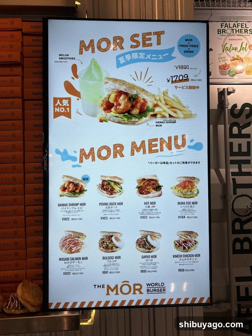 A digital menu board displaying the MOR Set promotion and a list of burger options with prices.